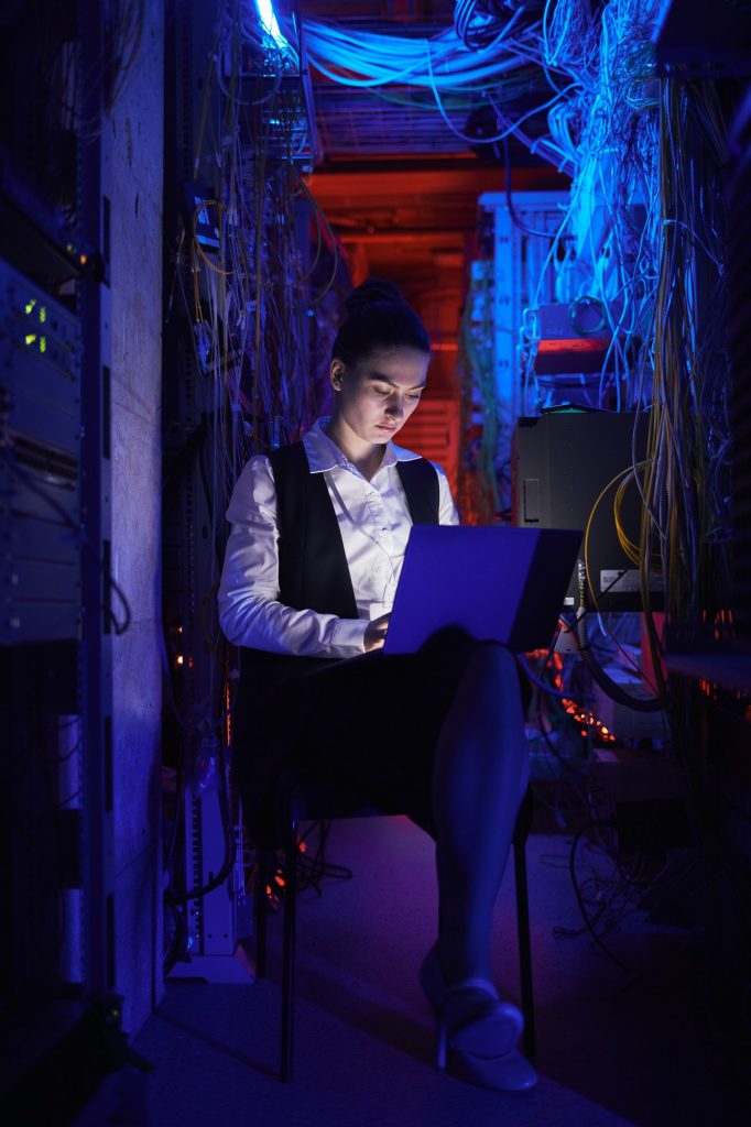 Female Technician Setting Computer Network